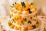 Cream cake decorated with bright mango pieces